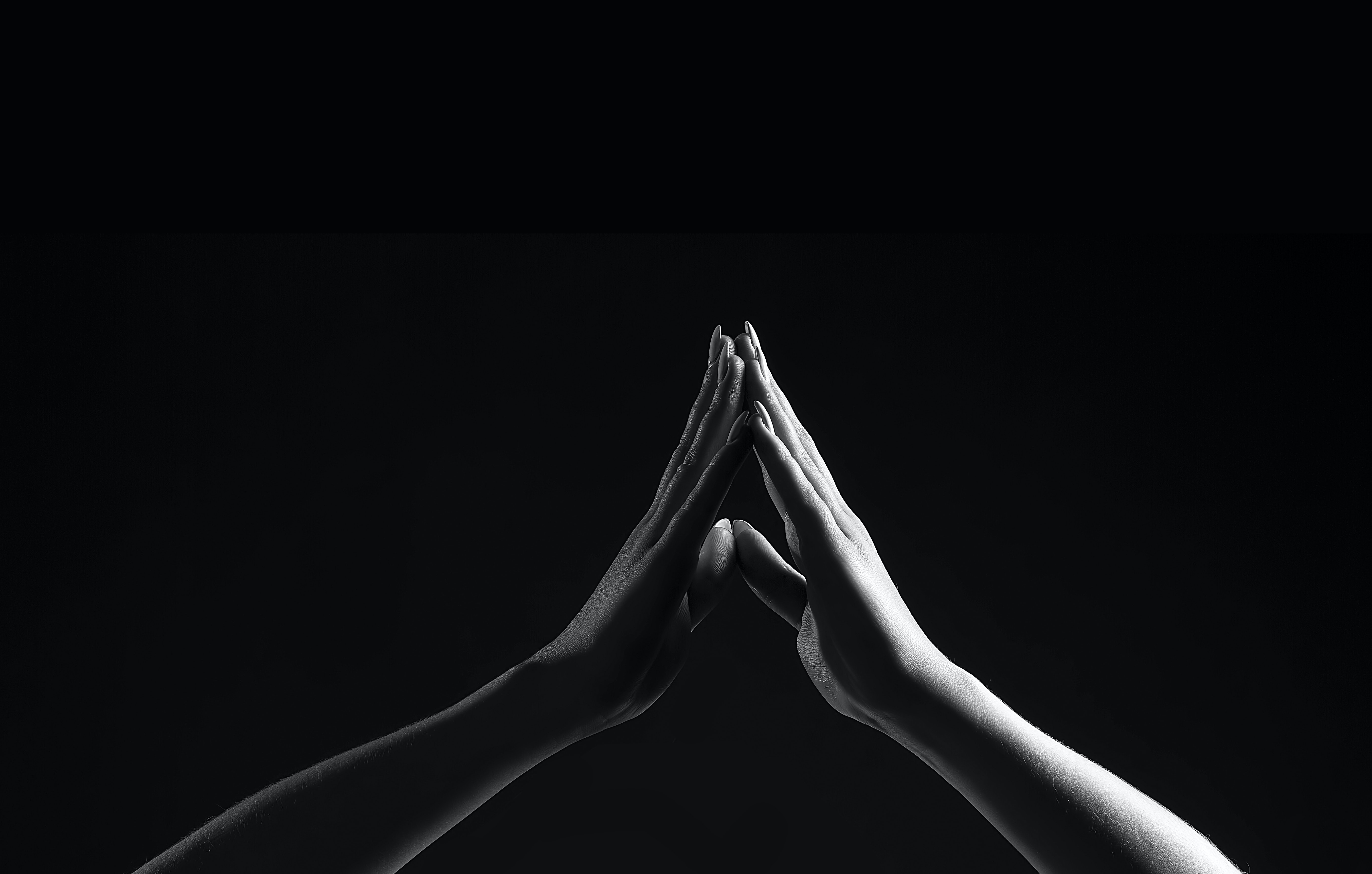 person's hands praying